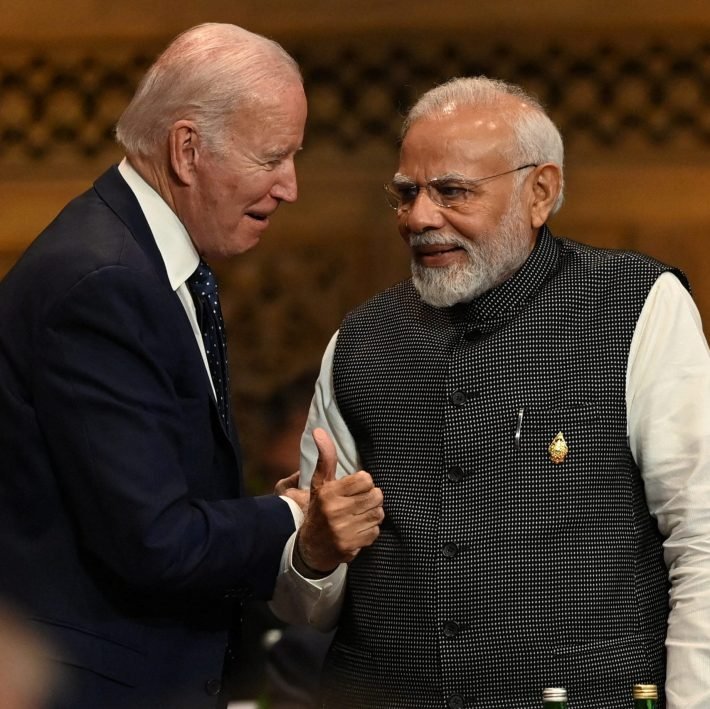 President of the U.S. Joe Biden speaks with Prime Minister of India Narendra Modi at the G20 Summit opening session in Nusa Dua, Bali, Indonesia, Tuesday, Nov. 15, 2022. PRASETYO UTOMO/G20 Media Center/Handout via REUTERS