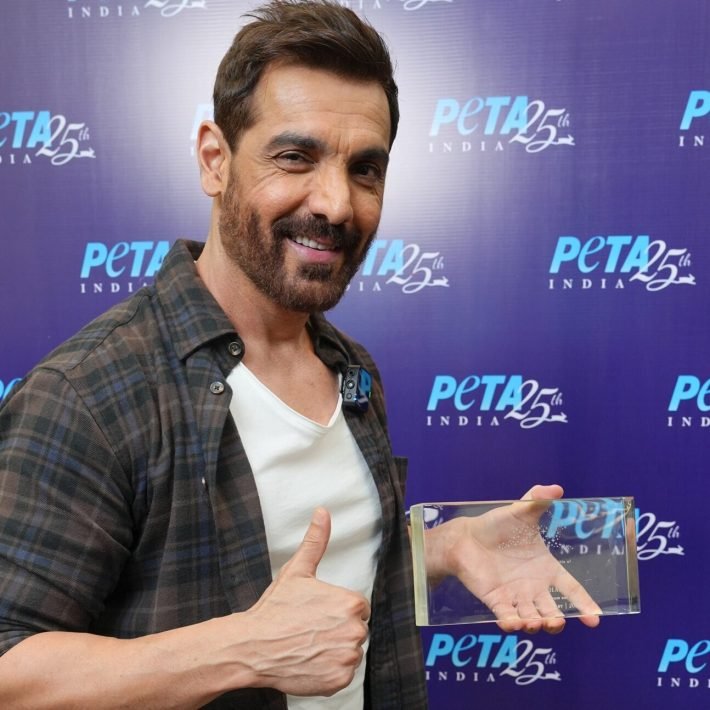 John Abraham with PETA India Honorary Director Plaque