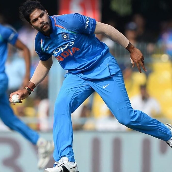 Indian cricket team bowler Umesh Yadav stops a ball during the first one day international (ODI) cricket match between India and West Indies at Barsapara Cricket Stadium in Guwahati on October 21, 2018. (Photo by SAJJAD HUSSAIN / AFP) / ----IMAGE RESTRICTED TO EDITORIAL USE - STRICTLY NO COMMERCIAL USE----- / GETTYOUT