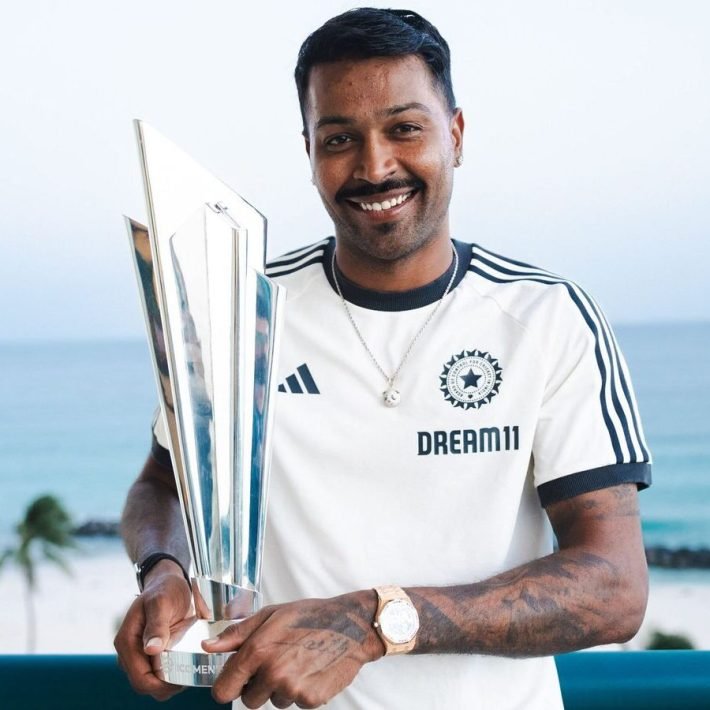 **EDS: IMAGE VIA @BCCI POSTED ON WEDNESDAY, JULY 3, 2024** Indian cricket player Hardik Pandya poses with the 2024 ICC Men's T20 World Cup trophy, in Barbados. (PTI Photo)(PTI07_03_2024_000112B)